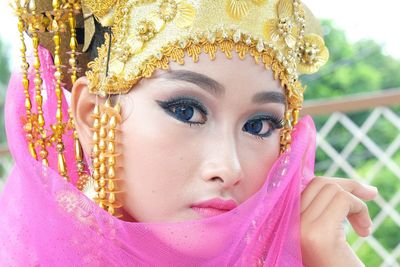 Portrait of young woman in traditional indonesian clothing