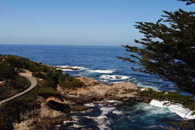 Scenic view of sea against clear blue sky