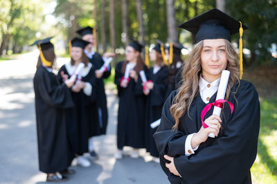 Rear view of woman wearing graduation gown