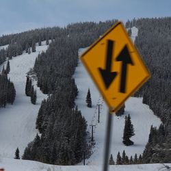 Scenic view of snow covered field with sign board