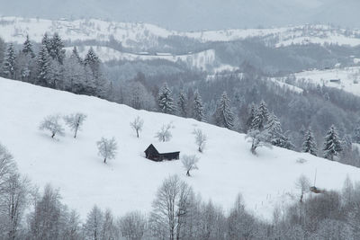 Scenic view of snow covered landscape and mountains