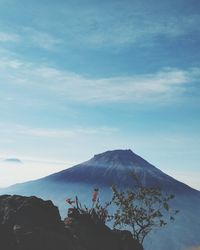 Scenic view of volcanic mountain against sky