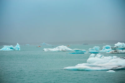 Scenic view of sea against clear sky during winter