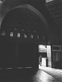 Silhouette of man at entrance of building