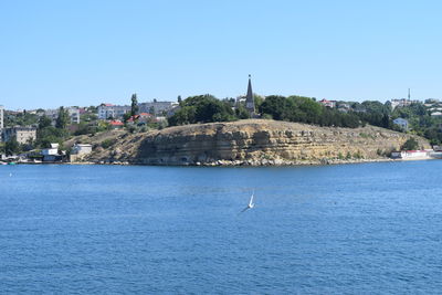 Scenic view of sea against clear blue sky