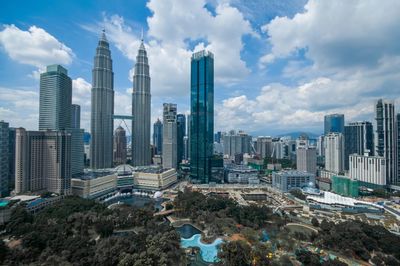 Modern buildings in city against sky