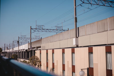 Low angle view of buildings against clear blue sky