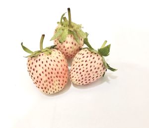 Close-up of fruits against white background