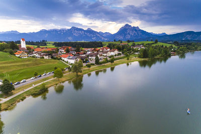 Scenic view of lake by houses in town