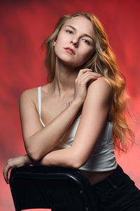Portrait of young woman sitting on stage