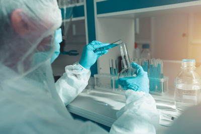 Scientist examining chemical in laboratory