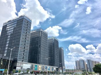 Low angle view of skyscrapers against sky