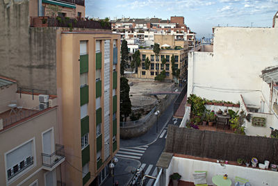 High angle view of street amidst buildings in town