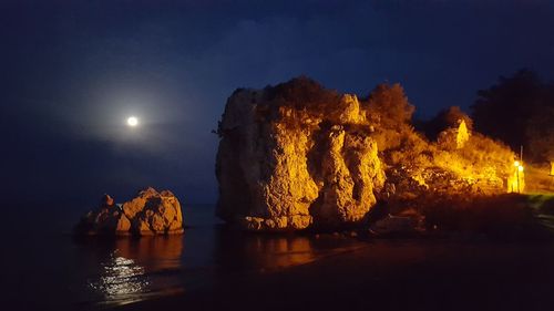 Panoramic view of sea against sky at night