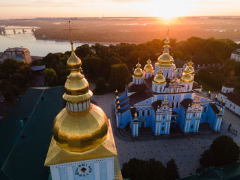 Traditional building against sky during sunset