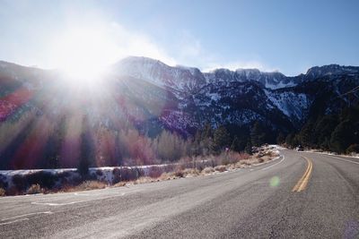 Road passing through snow covered mountain