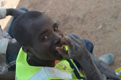 Side view of man smoking cigarette