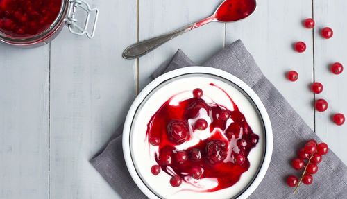 High angle view of strawberries in bowl on table