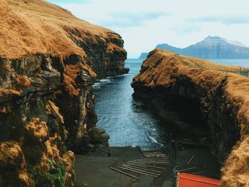 Scenic view of mountains against cloudy sky
