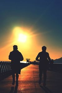 Silhouette of people at sunset