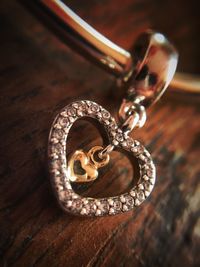 Close-up of heart shape jewelry on table