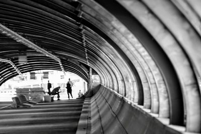 People walking in subway tunnel