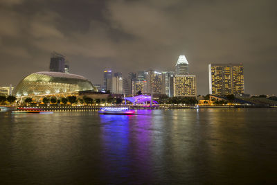 Illuminated city at waterfront