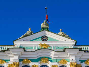 Low angle view of statue against blue sky