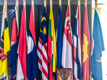 Multi colored flags hanging on clothesline