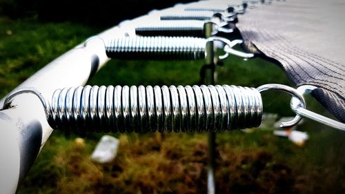 Cropped image of trampoline over field