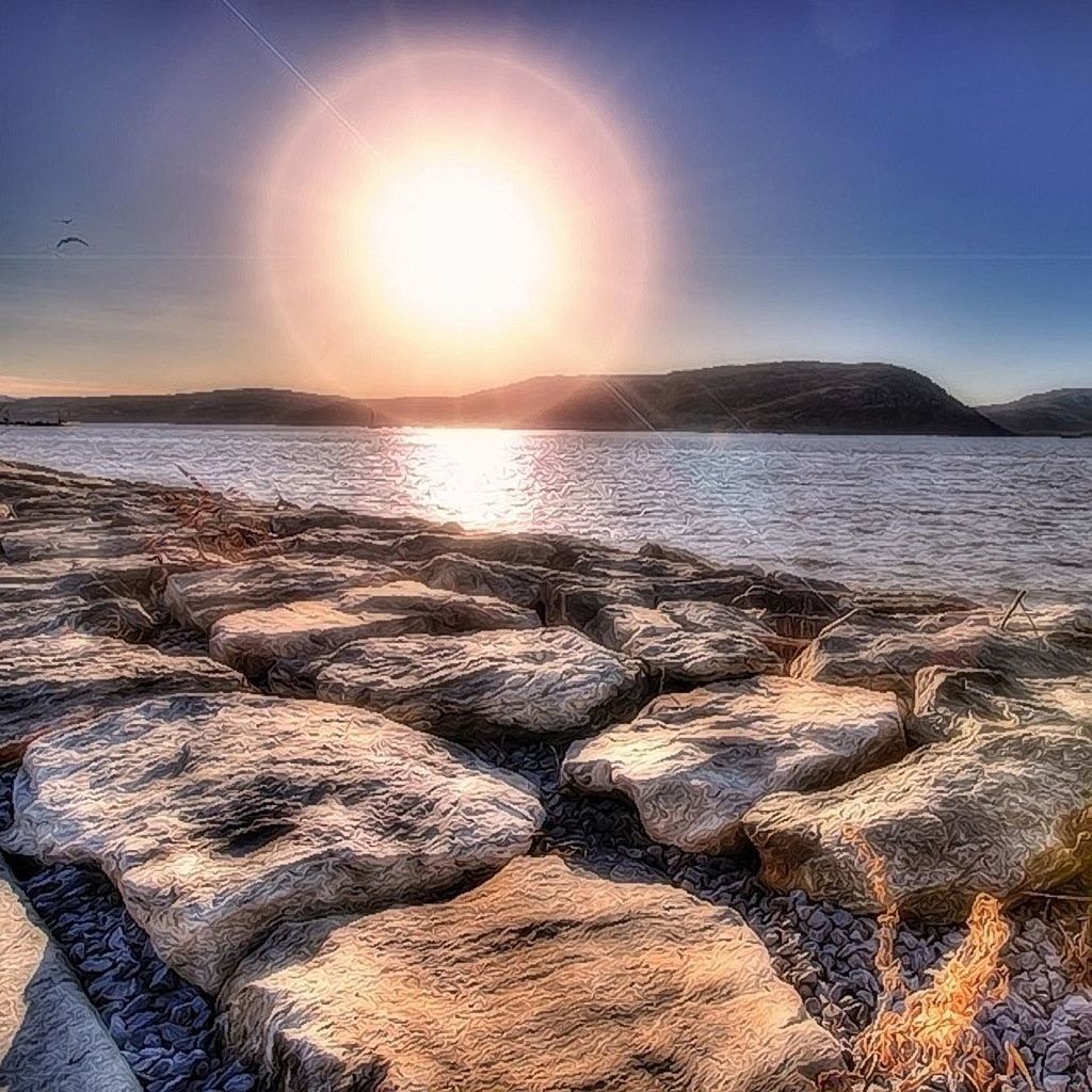 beach, sea, water, tranquility, tranquil scene, scenics, sun, sky, sunlight, beauty in nature, shore, sand, nature, sunbeam, idyllic, rock - object, sunset, reflection, lens flare, horizon over water