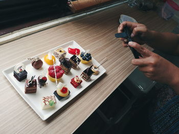 High angle view of woman preparing food on table