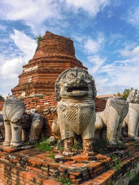 Statue of historic building against sky