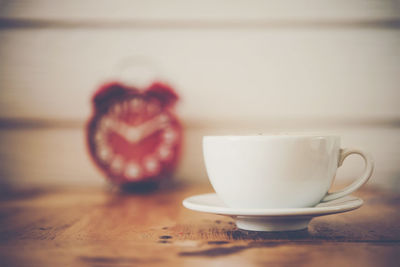 Close-up of coffee cup on table