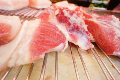 High angle view of meat on barbecue grill