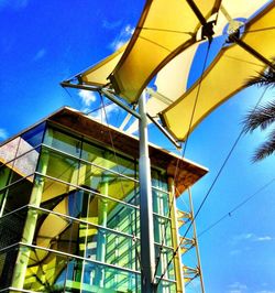 Low angle view of building against blue sky