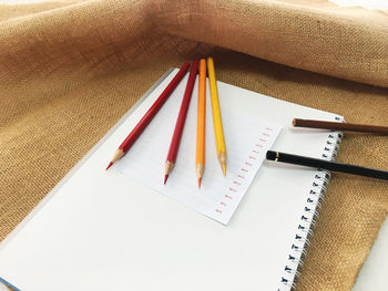 High angle view of colored pencils on table