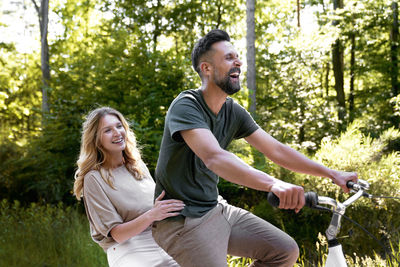 Side view of young woman exercising in park