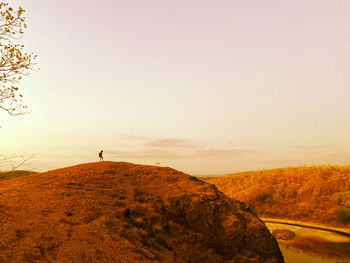 Scenic view of landscape against sky during sunset