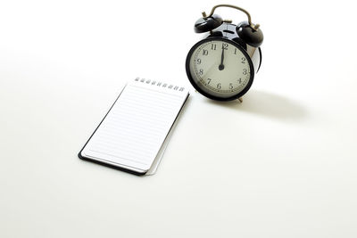 High angle view of clock on table
