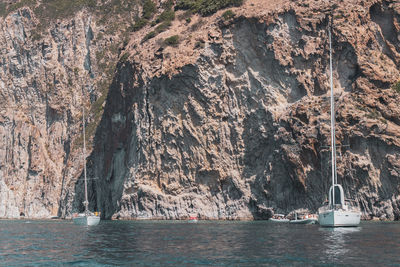 Scenic view of sea by rock formation