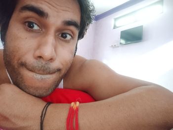 Portrait of young man at home