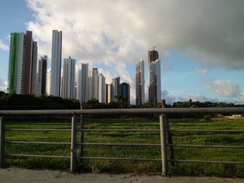 Modern buildings in city against sky