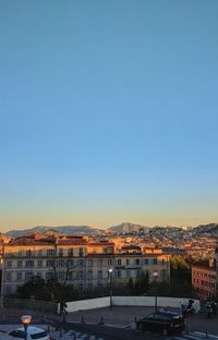 View of town against clear blue sky