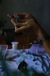 Cropped hand of woman holding water