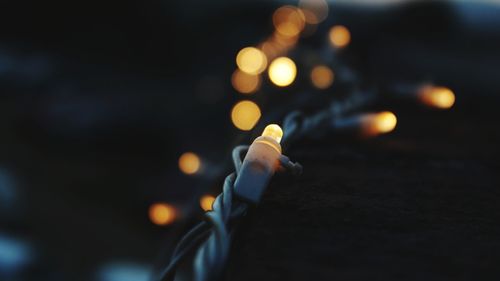 Close-up of hand with illuminated lights