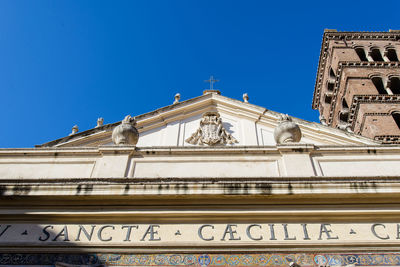 Low angle view of building against blue sky