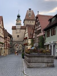 View of street amidst buildings against sky