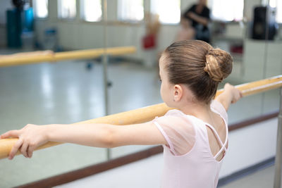 Young woman exercising in gym