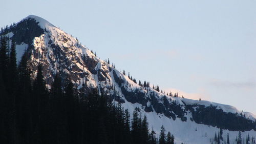 Scenic view of mountains against clear sky during winter